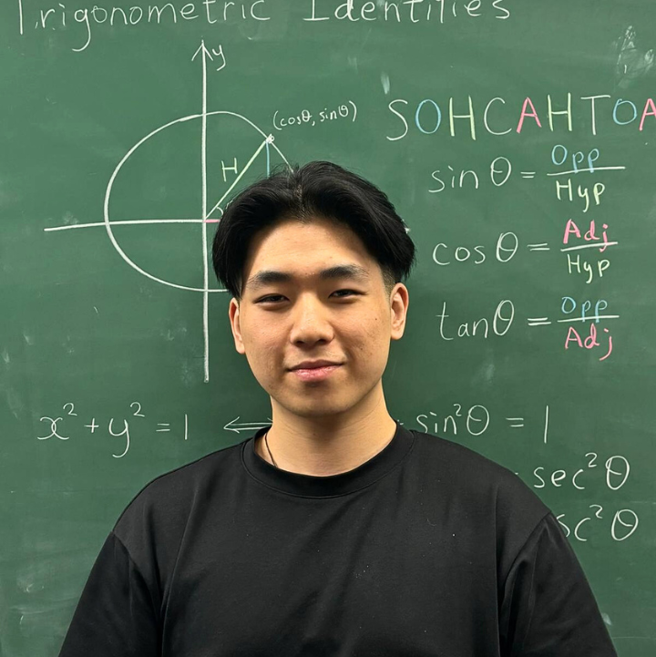 Russell Chen, Founder of eAcademy, in front of a chalkboard with trigonometric identities